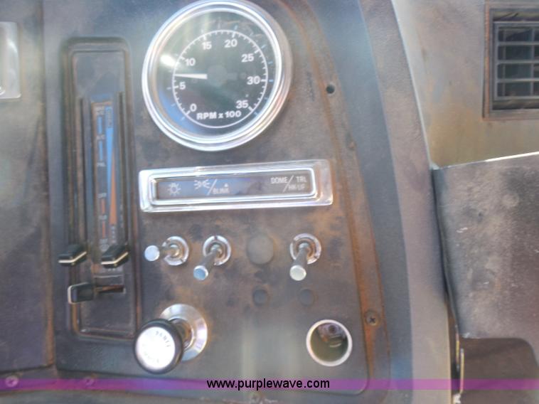 image for item I1378 1994 Ford LNT8000 tilt bed truck