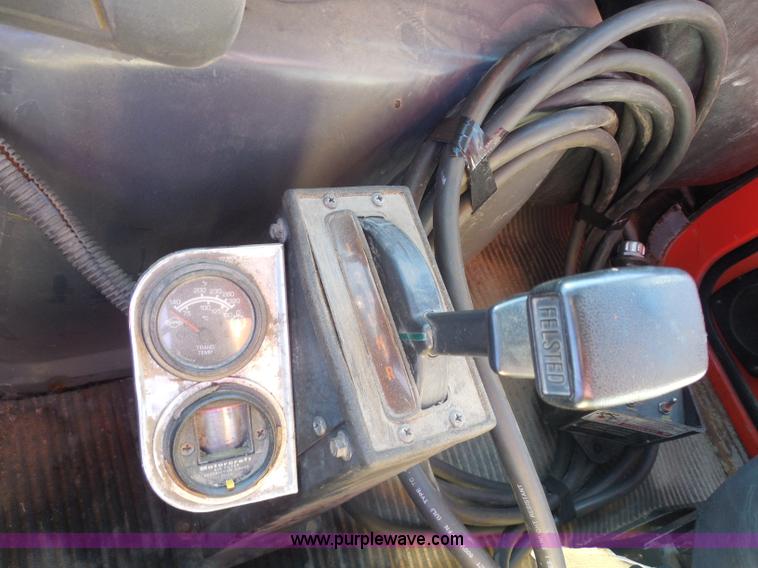 image for item I1378 1994 Ford LNT8000 tilt bed truck