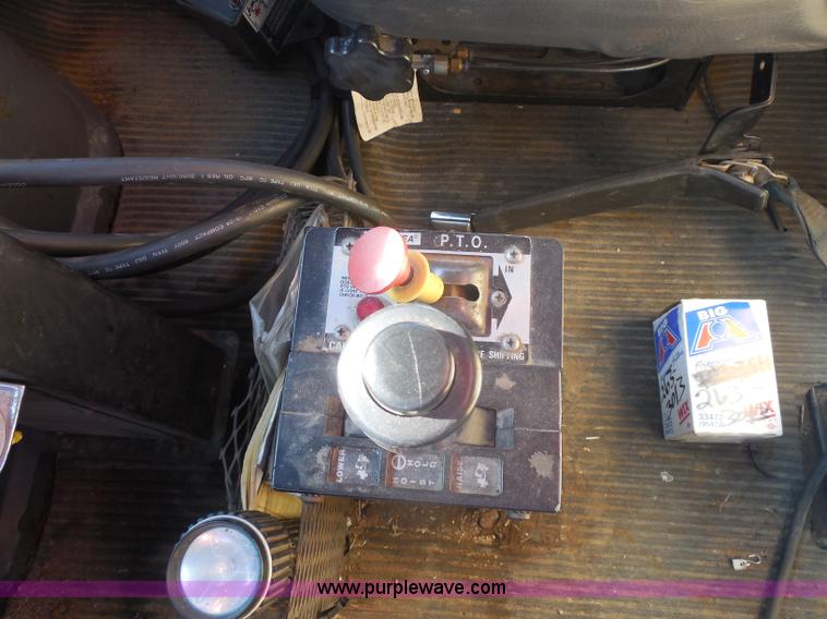 image for item I1378 1994 Ford LNT8000 tilt bed truck