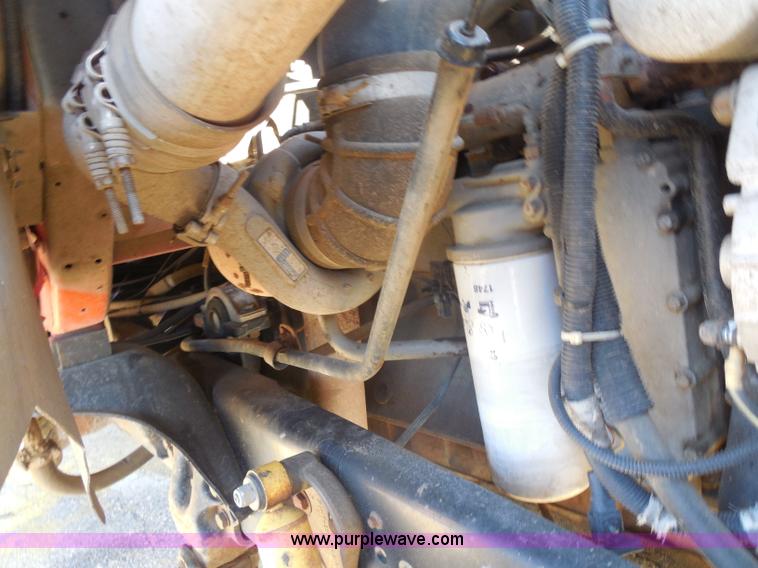 image for item I1378 1994 Ford LNT8000 tilt bed truck