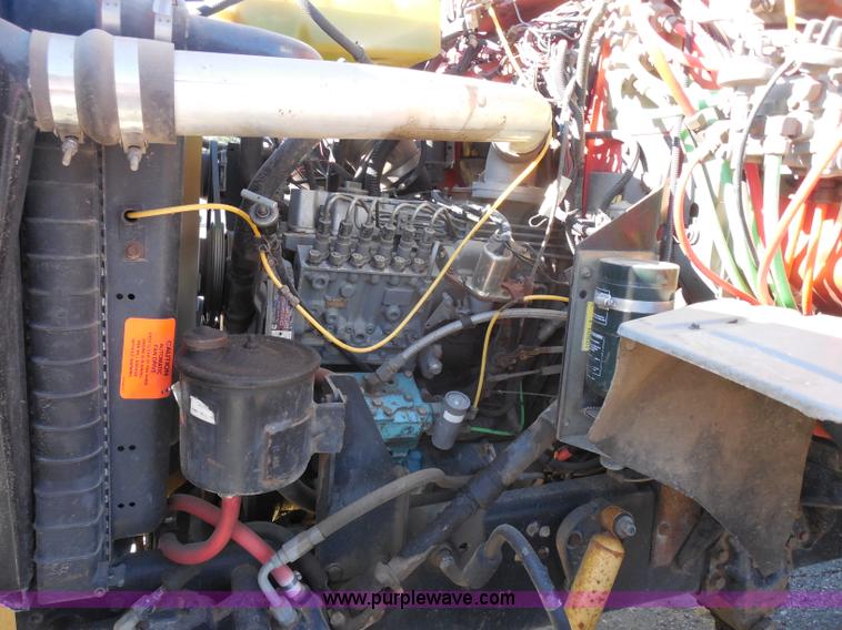 image for item I1378 1994 Ford LNT8000 tilt bed truck