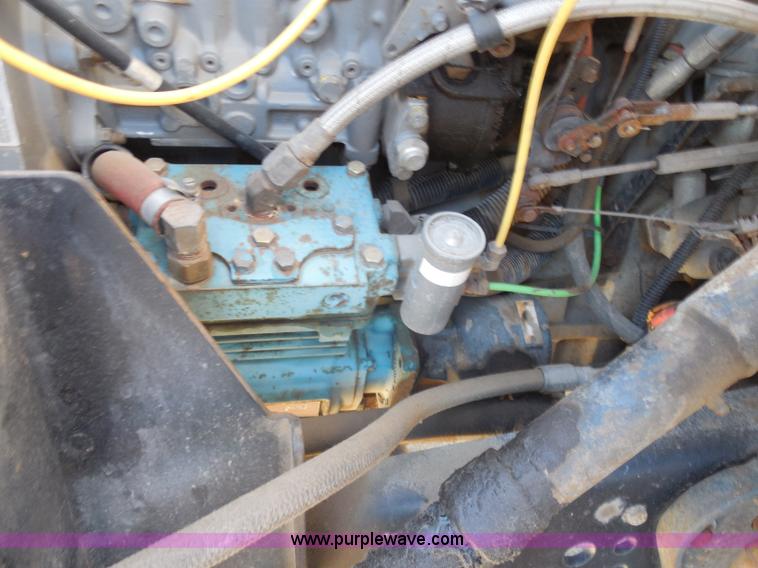 image for item I1378 1994 Ford LNT8000 tilt bed truck