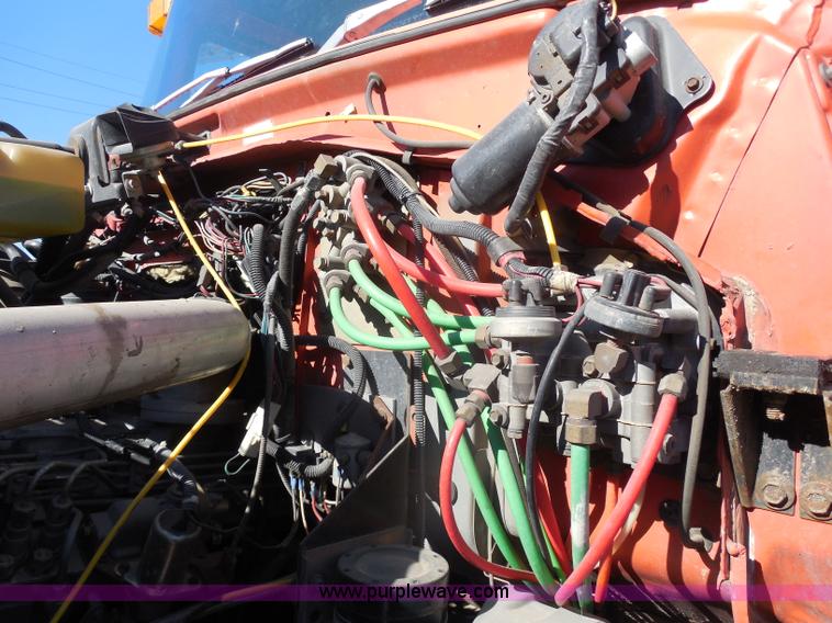 image for item I1378 1994 Ford LNT8000 tilt bed truck