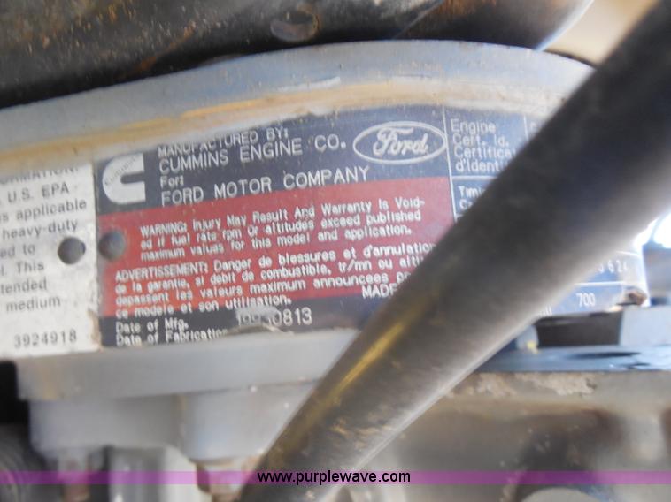 image for item I1378 1994 Ford LNT8000 tilt bed truck