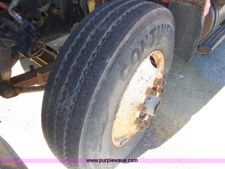 image for item I1378 1994 Ford LNT8000 tilt bed truck