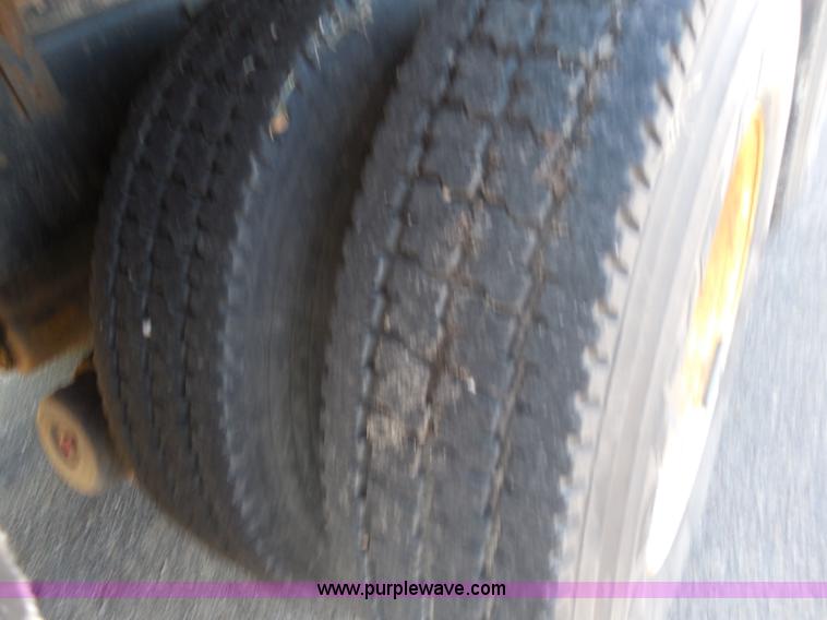 image for item I1378 1994 Ford LNT8000 tilt bed truck