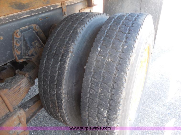 image for item I1378 1994 Ford LNT8000 tilt bed truck