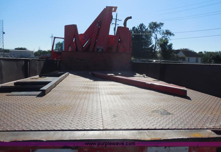 image for item I1378 1994 Ford LNT8000 tilt bed truck