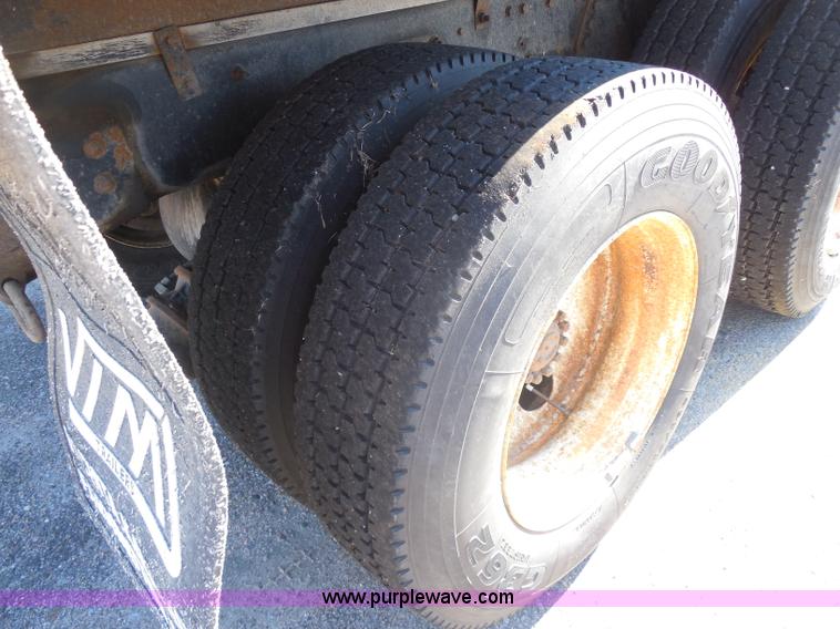 image for item I1378 1994 Ford LNT8000 tilt bed truck