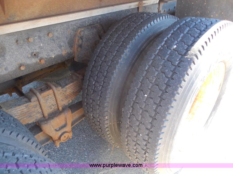 image for item I1378 1994 Ford LNT8000 tilt bed truck