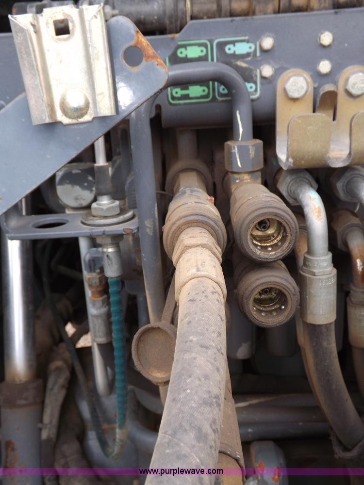 image for item I7528 1999 New Holland TV-140 MFWD bi-directional tractor