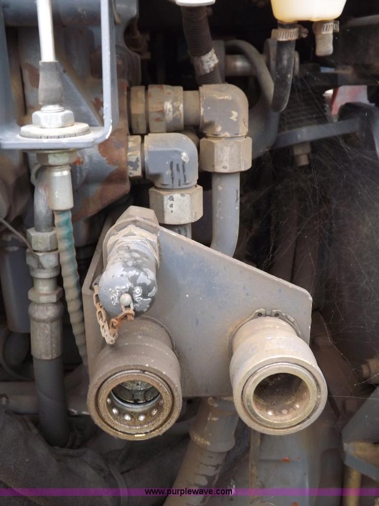 image for item I7528 1999 New Holland TV-140 MFWD bi-directional tractor