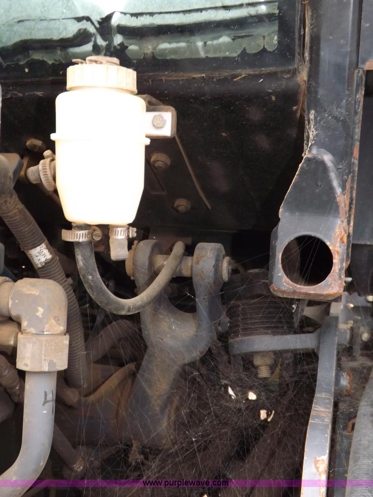 image for item I7528 1999 New Holland TV-140 MFWD bi-directional tractor