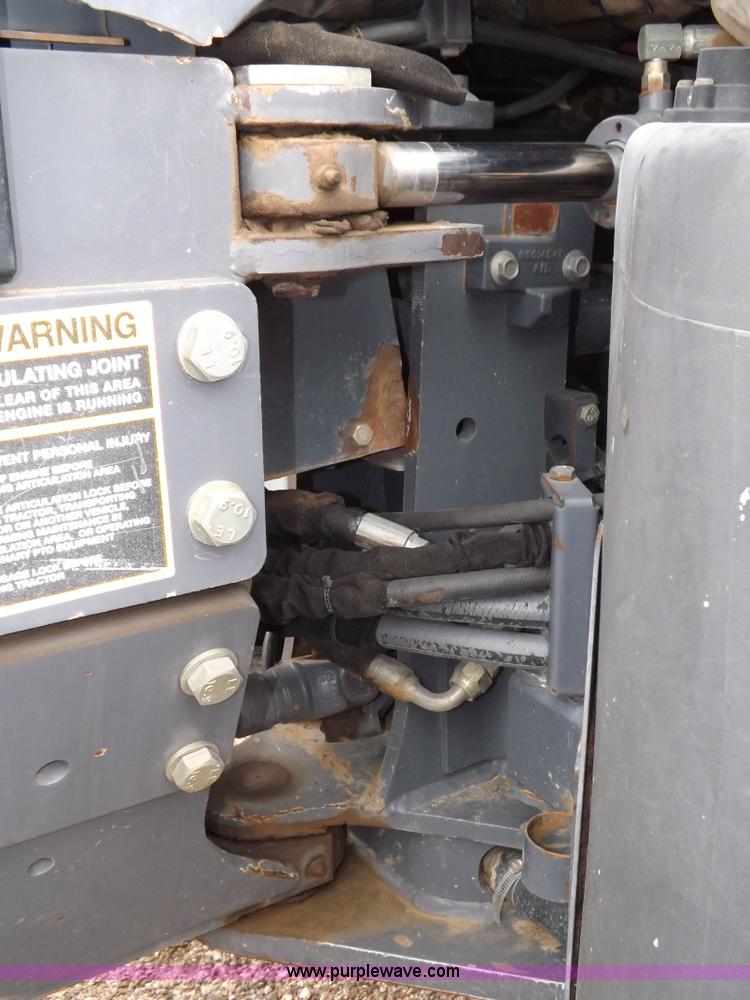 image for item I7528 1999 New Holland TV-140 MFWD bi-directional tractor