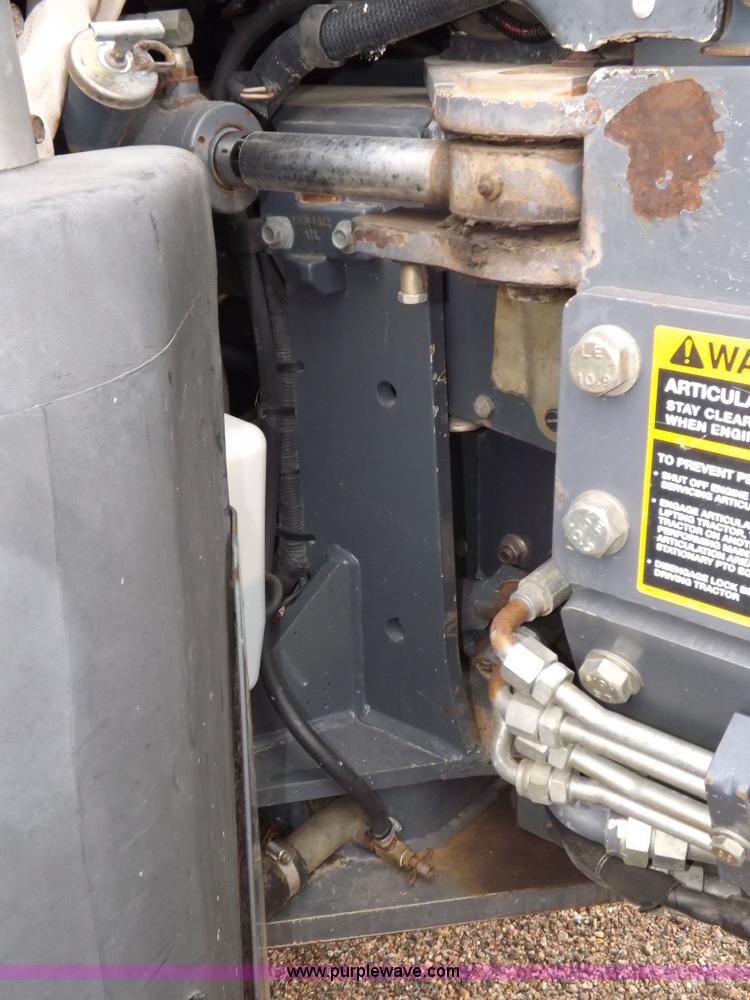 image for item I7528 1999 New Holland TV-140 MFWD bi-directional tractor