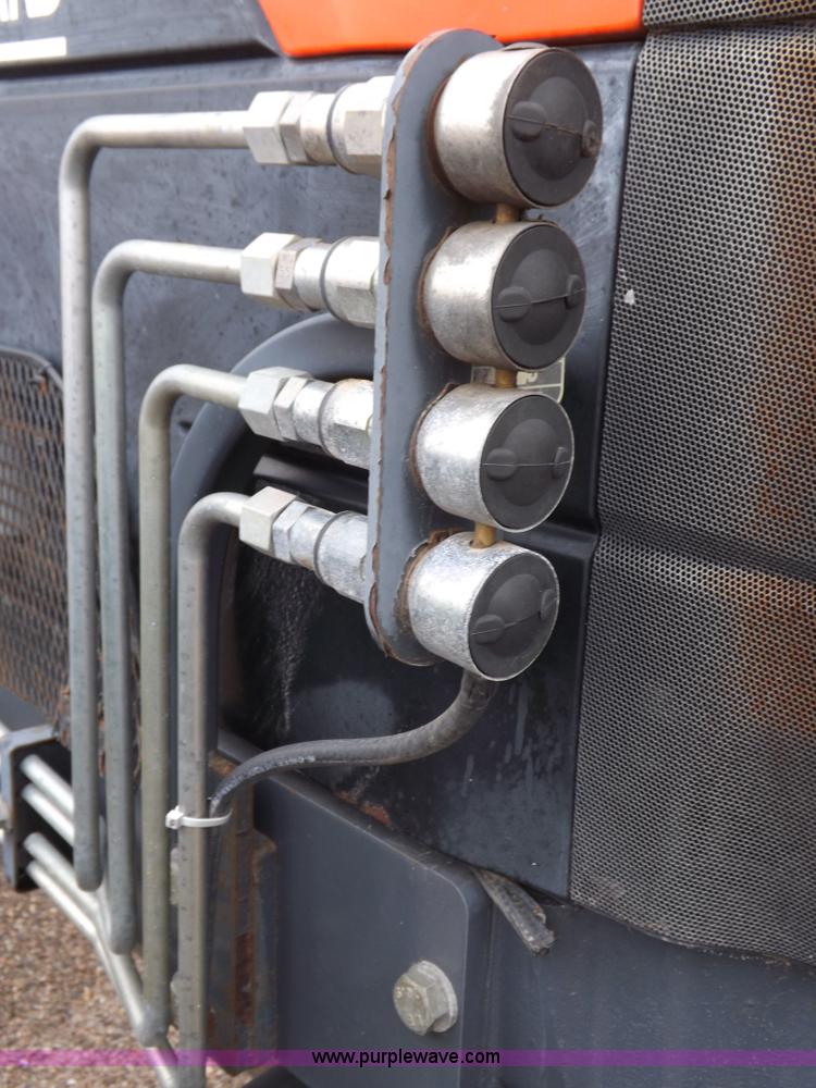 image for item I7528 1999 New Holland TV-140 MFWD bi-directional tractor