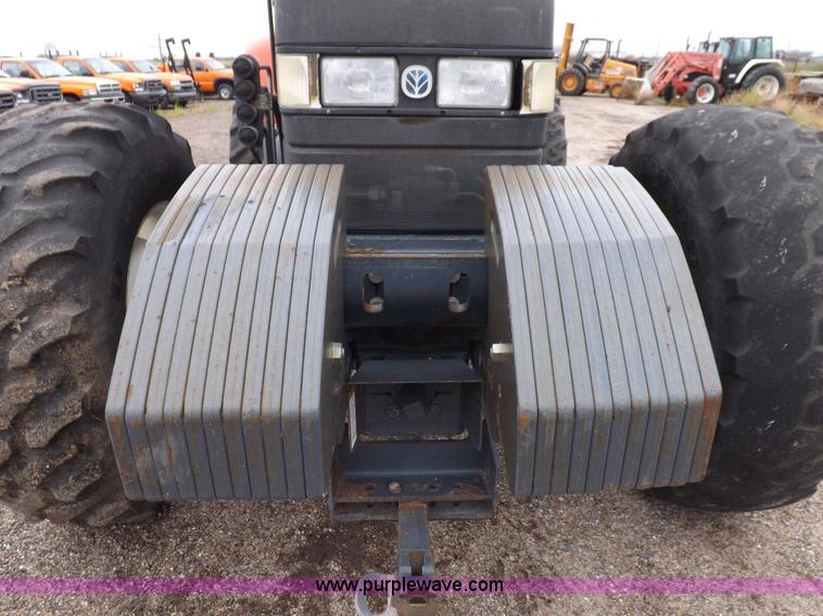 image for item I7528 1999 New Holland TV-140 MFWD bi-directional tractor