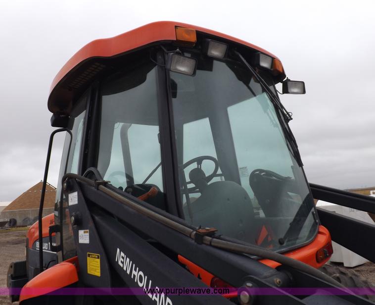 image for item I7528 1999 New Holland TV-140 MFWD bi-directional tractor