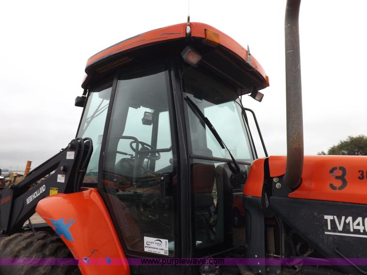 image for item I7528 1999 New Holland TV-140 MFWD bi-directional tractor