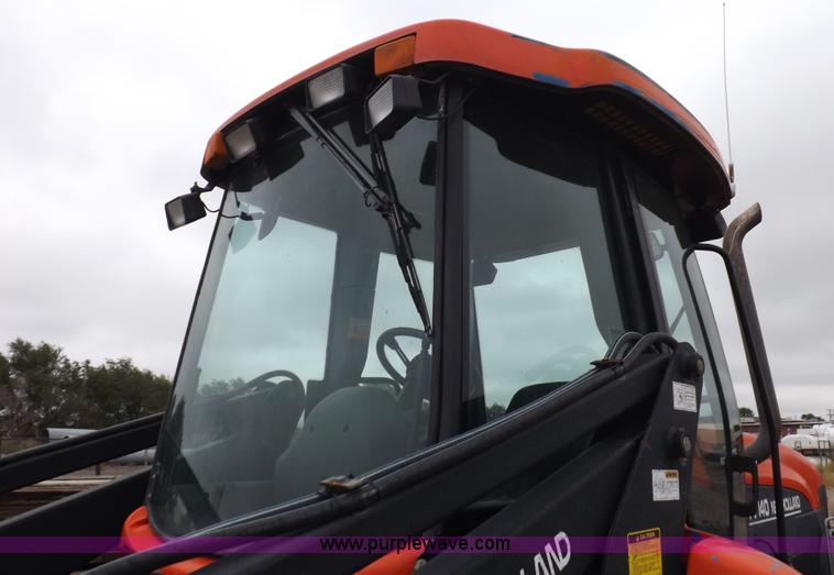 image for item I7528 1999 New Holland TV-140 MFWD bi-directional tractor