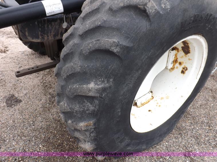 image for item I7528 1999 New Holland TV-140 MFWD bi-directional tractor