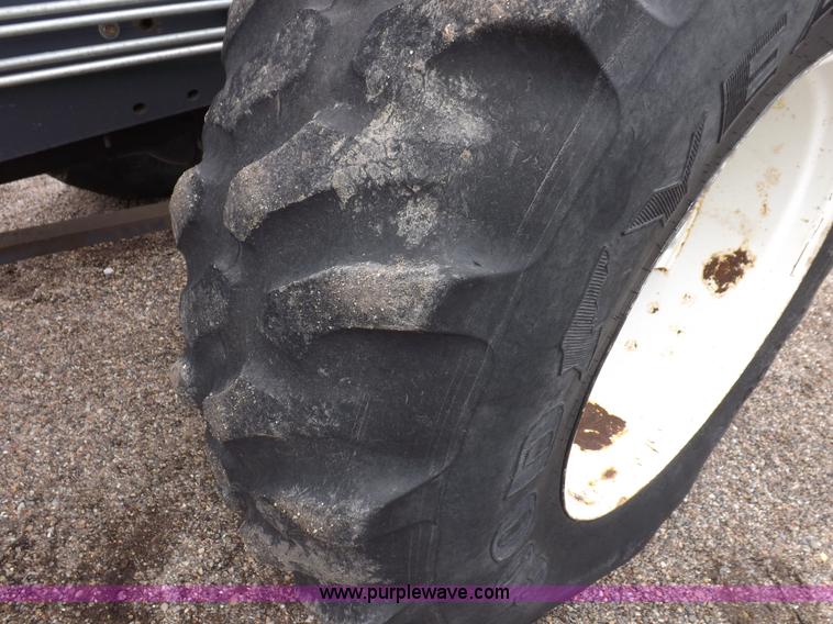 image for item I7528 1999 New Holland TV-140 MFWD bi-directional tractor