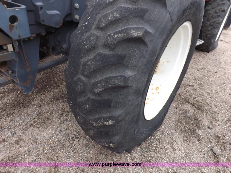 image for item I7528 1999 New Holland TV-140 MFWD bi-directional tractor