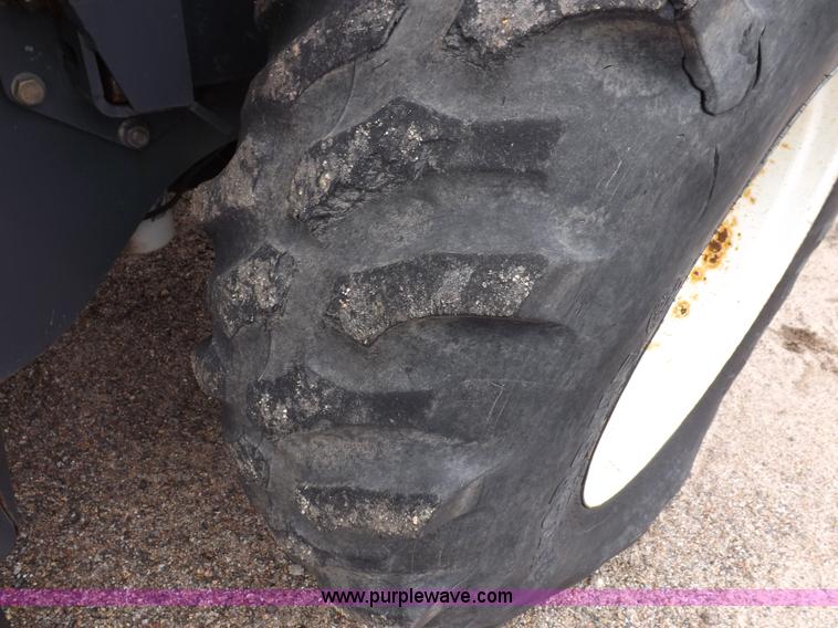 image for item I7528 1999 New Holland TV-140 MFWD bi-directional tractor