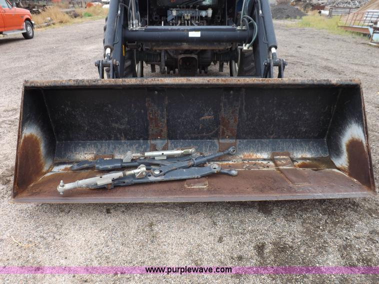 image for item I7528 1999 New Holland TV-140 MFWD bi-directional tractor