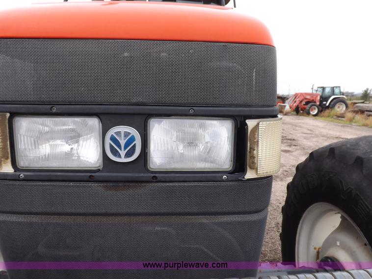 image for item I7528 1999 New Holland TV-140 MFWD bi-directional tractor