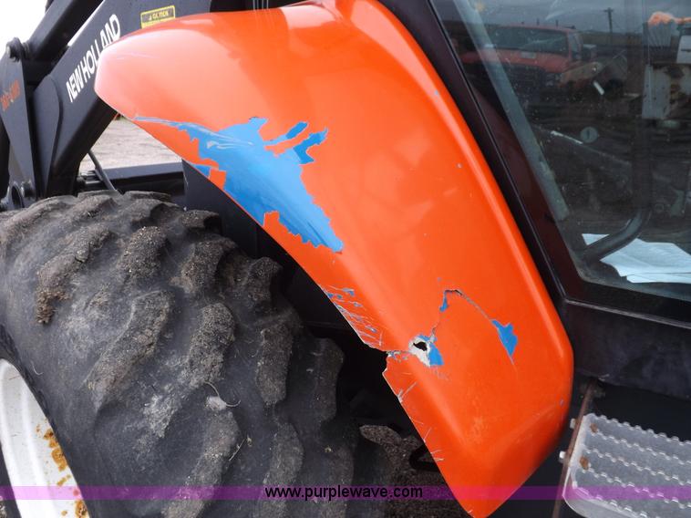 image for item I7528 1999 New Holland TV-140 MFWD bi-directional tractor