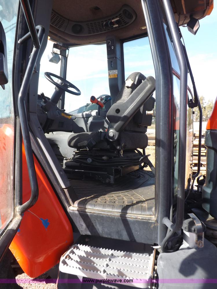 image for item I7528 1999 New Holland TV-140 MFWD bi-directional tractor