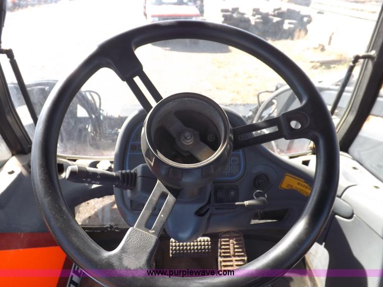 image for item I7528 1999 New Holland TV-140 MFWD bi-directional tractor