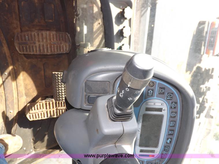 image for item I7528 1999 New Holland TV-140 MFWD bi-directional tractor