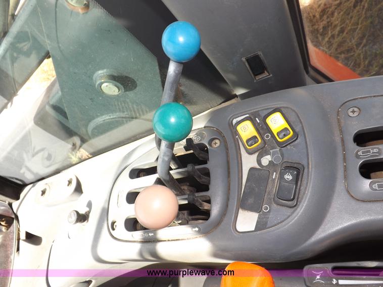 image for item I7528 1999 New Holland TV-140 MFWD bi-directional tractor