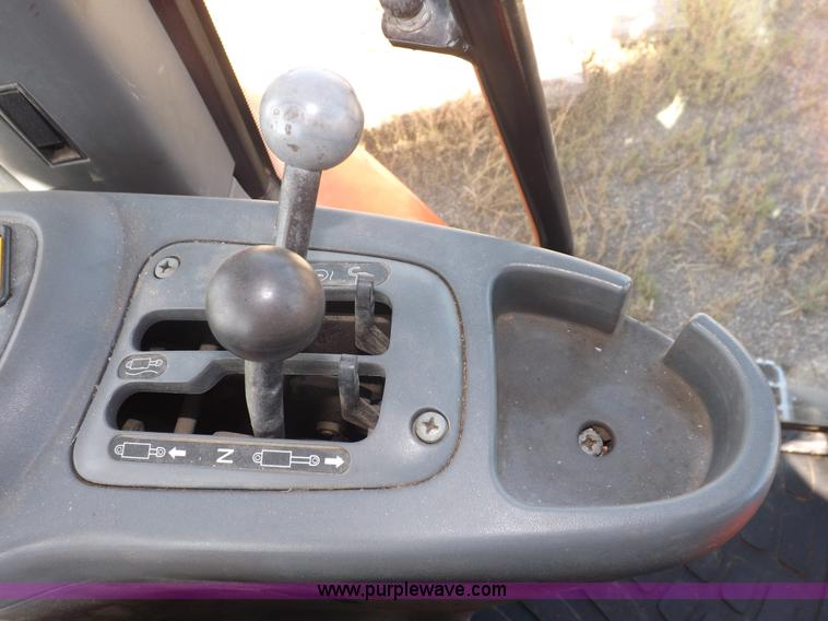 image for item I7528 1999 New Holland TV-140 MFWD bi-directional tractor