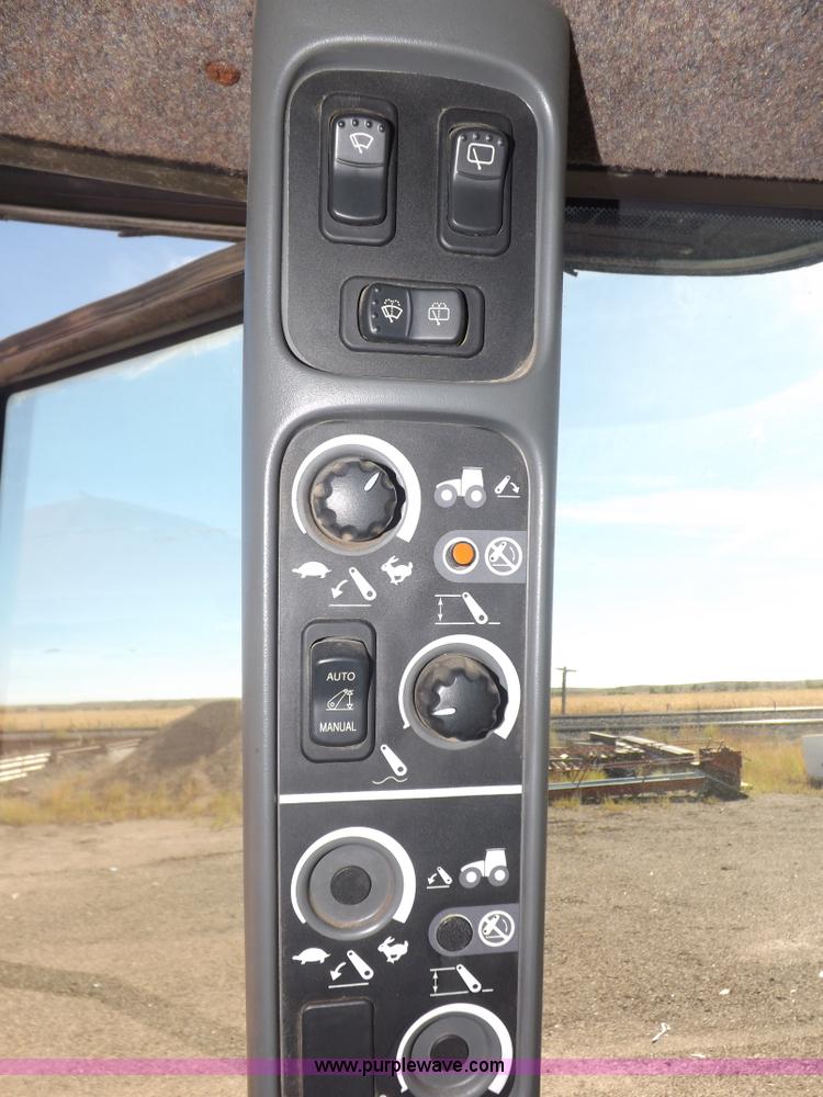 image for item I7528 1999 New Holland TV-140 MFWD bi-directional tractor