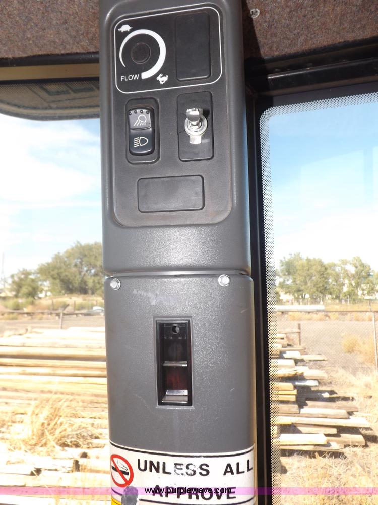 image for item I7528 1999 New Holland TV-140 MFWD bi-directional tractor