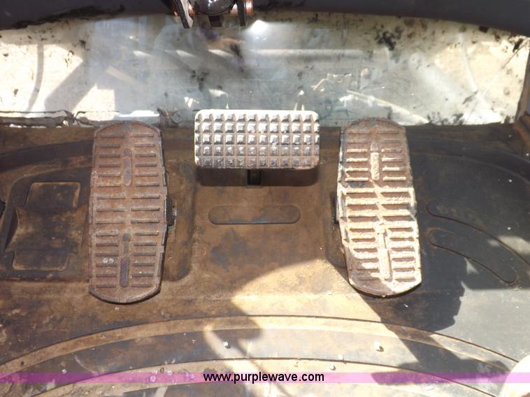 image for item I7528 1999 New Holland TV-140 MFWD bi-directional tractor