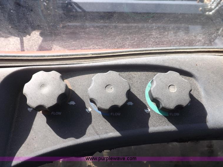 image for item I7528 1999 New Holland TV-140 MFWD bi-directional tractor