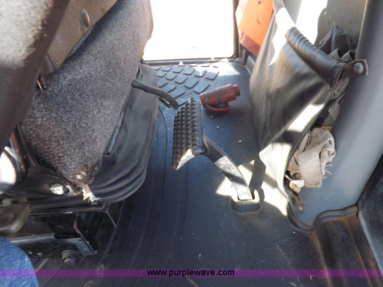 image for item I7528 1999 New Holland TV-140 MFWD bi-directional tractor