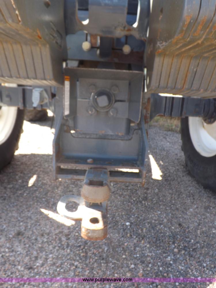 image for item I7528 1999 New Holland TV-140 MFWD bi-directional tractor