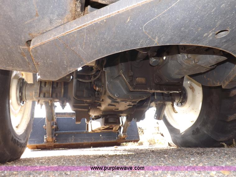 image for item I7528 1999 New Holland TV-140 MFWD bi-directional tractor