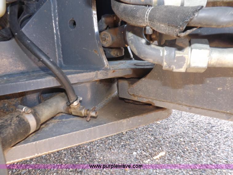 image for item I7528 1999 New Holland TV-140 MFWD bi-directional tractor