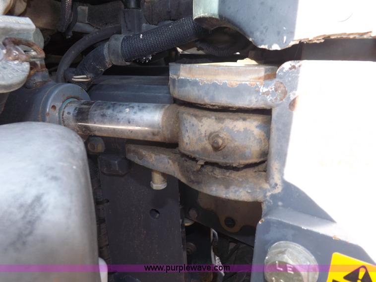 image for item I7528 1999 New Holland TV-140 MFWD bi-directional tractor