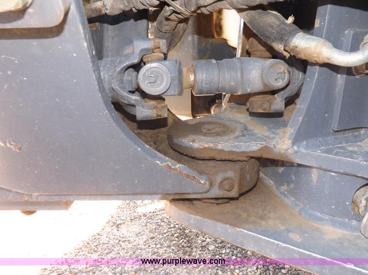 image for item I7528 1999 New Holland TV-140 MFWD bi-directional tractor