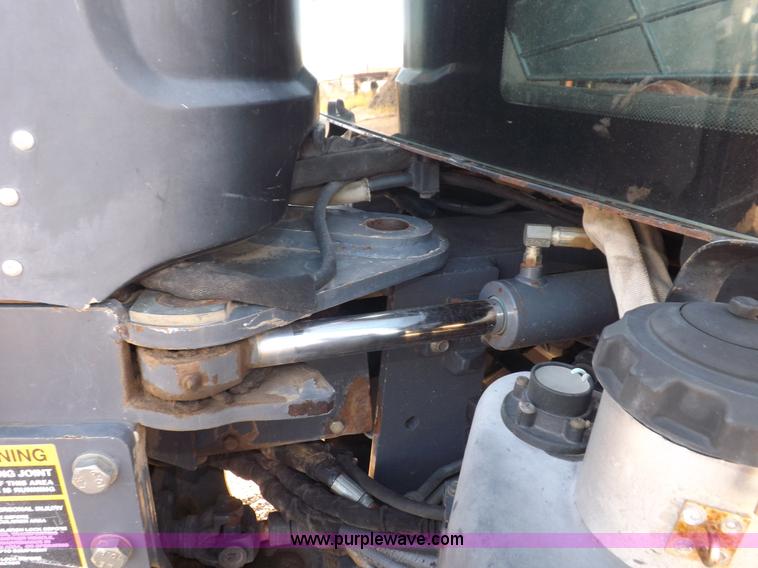 image for item I7528 1999 New Holland TV-140 MFWD bi-directional tractor