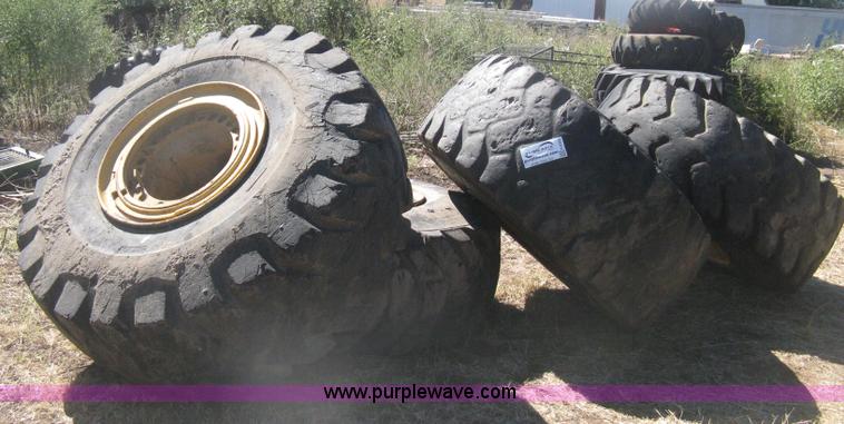 image for item H6322 (4) Caterpillar 980 loader tires and wheels