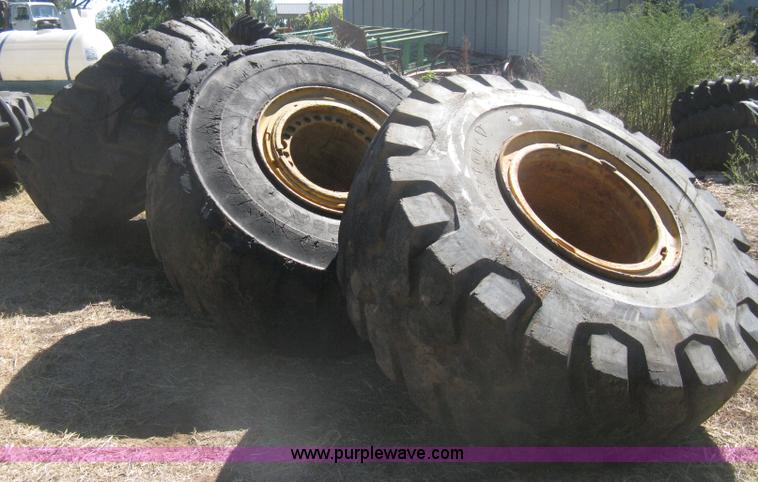 image for item H6322 (4) Caterpillar 980 loader tires and wheels