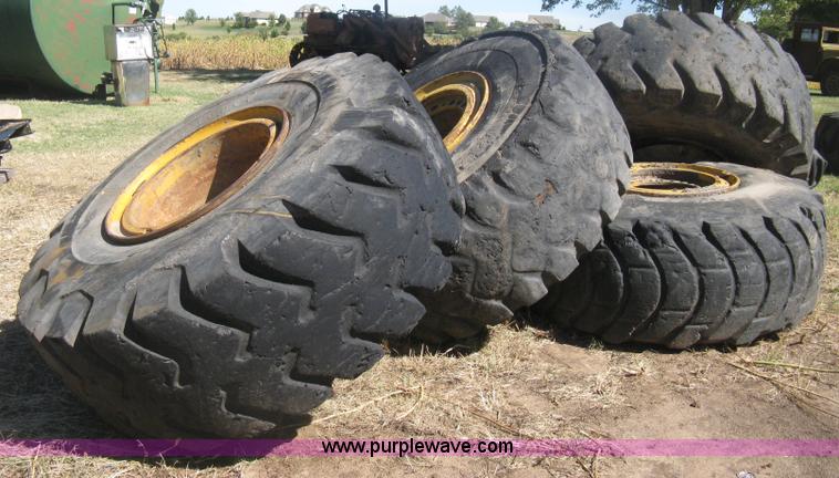image for item H6322 (4) Caterpillar 980 loader tires and wheels